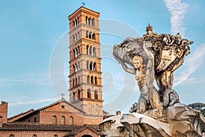 Fountain of Tritons and church Santa Maria in Cosmedin in Rome, Italy