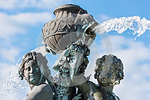 Fountain with two angels on the place du breuil in puy en velay, Auvergne, France