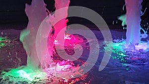 Fountain water illuminated colorful lights night Flow water rising illuminated