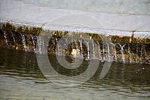 Fountain and water jets on a bright sunny day