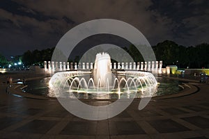 Fountain at World War II memorial at night in Washington