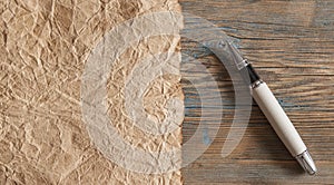 Fountain writing pen on brown paper background