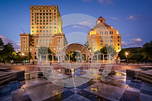 Fountains and buildings at night, at Pack Square Park, in downtown Asheville, North Carolina.