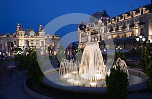 Fountains at dusk in Casino square in Monaco photo