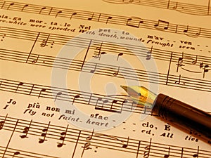 Fountian Pen atop sheet music (sepia toned)