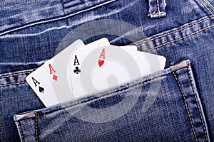 Four aces in blue jeans pocket