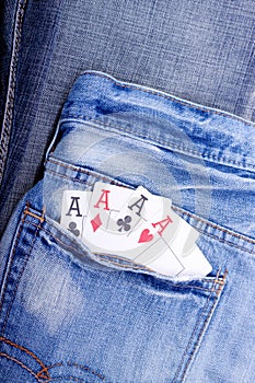 Four aces in blue jeans pocket