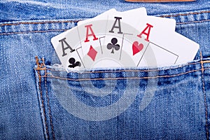 Four aces in blue jeans pocket