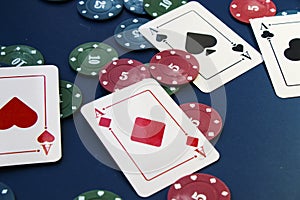 Four aces and chips, card game, cards on the table. Poker and blackjack