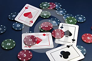 Four aces and chips, card game, cards on the table. Poker and blackjack