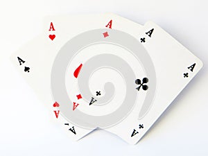 Four aces from a classic designed card game disposed like a fan