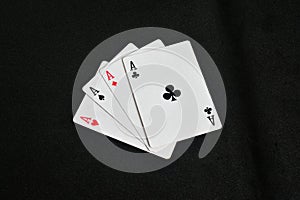 four aces , four of a kind aces poker black background