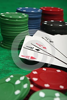 Four aces with gambling chips