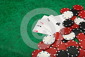 Four aces with gambling chips