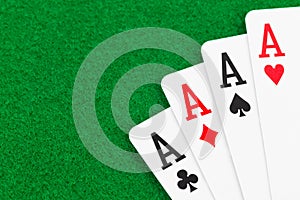 Four aces on green felt