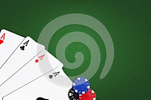 Four Aces on a green poker background.Copy Space. Gamble. Playing cards