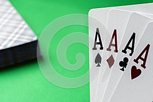 Four aces poker cards against green background. Four of a kind combination in poker game. Poker combinations concept