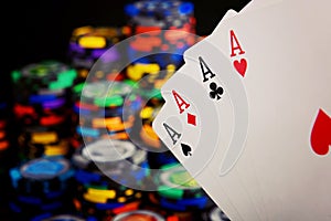 Four aces and stack of casino chips