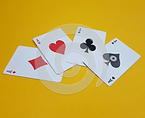 Four aces on yellow