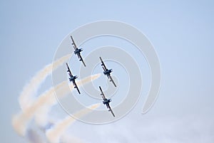 Four Aermacchi in a steep turn