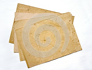 Four aged sheets of paper