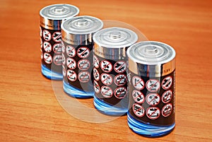 Alkaline battery cells with warning message icons on them photo