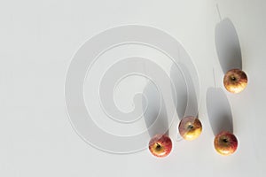 Four apples minimalist composition with negative space. photo