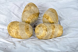 Four baker`s potato ready to cook