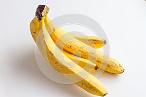 Four banana on white background.