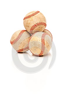 Four Baseballs Isolated on Reflective White