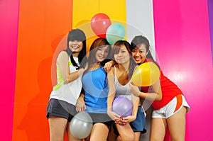 Four Beautiful Girlfriends posing with balloons