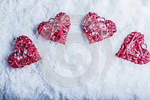 Four beautiful romantic vintage hearts on a white frosty snow background. Love and St. Valentines Day concept.