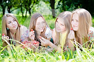 Four beautiful young women girl friends outdoors