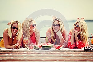 Four best friends laughing and having faun at lake