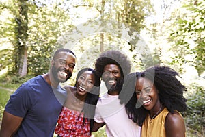 Four black adult friends in the forest, head and shoulders