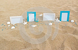 Four blank photo frames on the sand beach with decoration