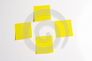 Four Blank Yellow Sticky Notes on White