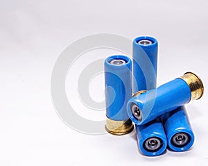 Four blue, rifled 12 gauge shotgun shells