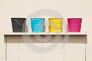 Four buckets of different colors
