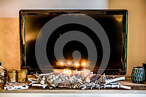 Four burning advent candles, beautiful decorated setup and branches light christmas with textspace in TV in Background photo