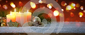 Four burning Advent candles and decoration. Christmas background.