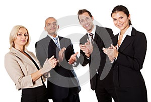 Four business people applauding