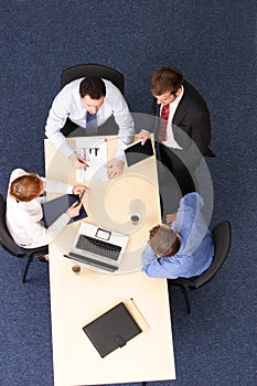 Four business people meeting