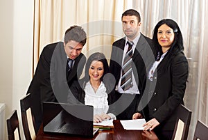 Four business people working