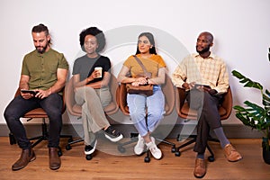 Four candidates sitting in a row waiting for job interview, creative tech coder