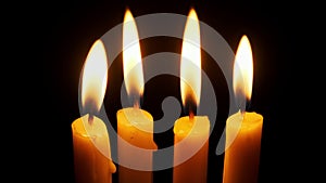 Four Candles Burning and Extinguished on a Black Background, Copy Space