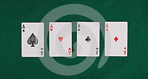 four card aces isolated on green