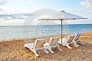 Four Chair and Umbrella at the beach