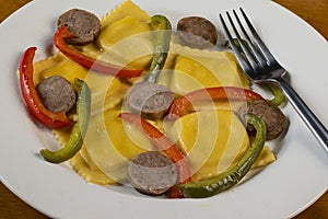 four cheese ravioli with sweet italain sausage and peppers