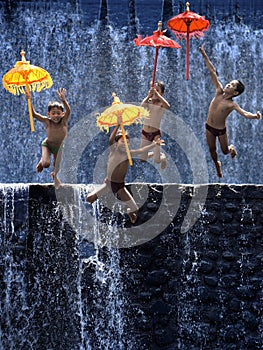 Four Children Jump With Umbrellas